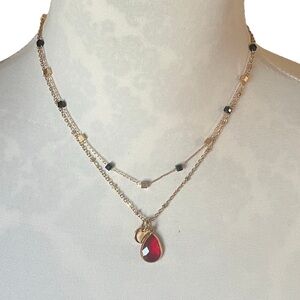 Layered Gold Tone Necklace with Red Teardrop Pendant & Beaded Accents